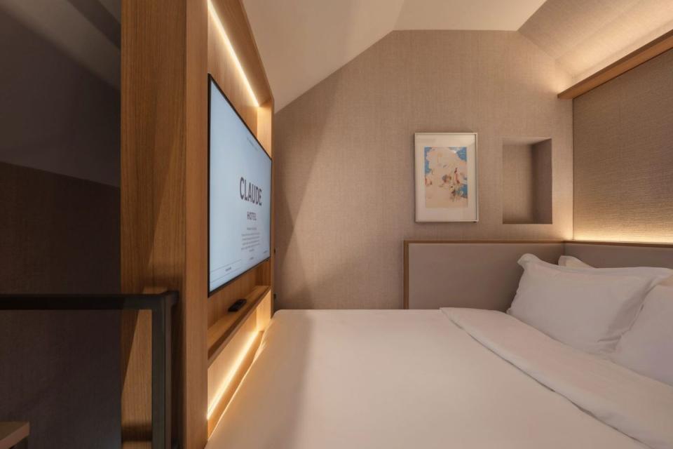 Claude Hotel China Town Singapore queen bed snug with inbuilt TV wall mounted and adjustable for perfecr viewing