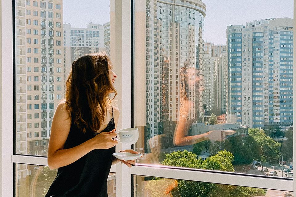 Women looking out of a high rise building in a Singapore property