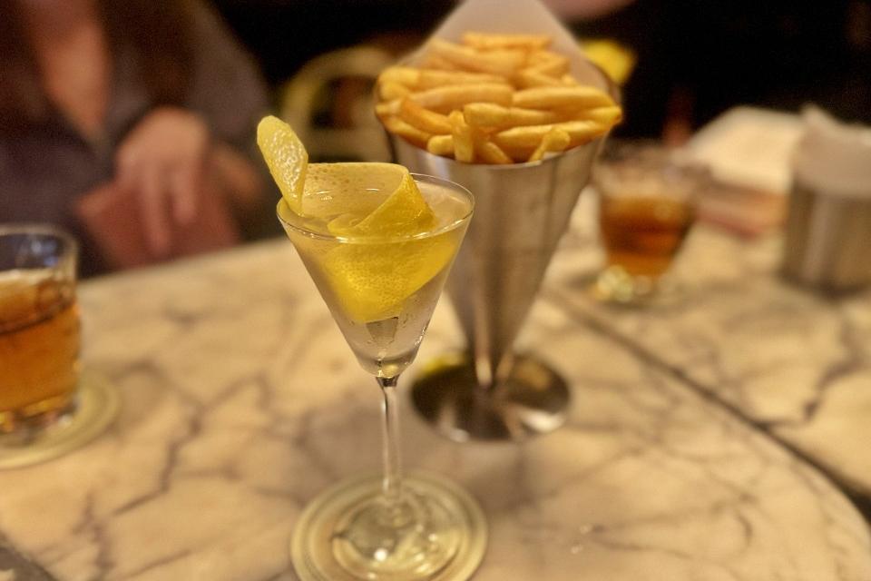 Cocktail 1 at Gibson Tenth Anniversary Expat Choice Report Singapore Rebecca Assice and Husband Robin Assice standing at the entrance of Gibson Singapore celebrating their tenth anniversary