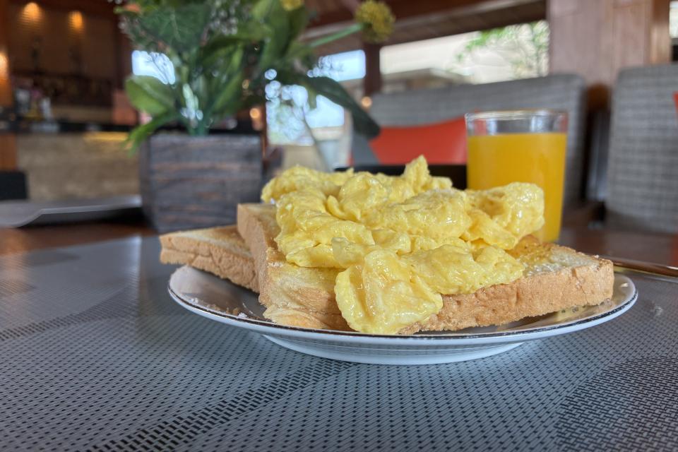 Breakfast Ubud Bali Scrambled Eggs, orange Juice, brewed Coffee, cereals, toast and Jam 