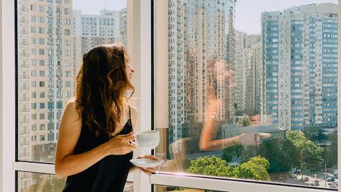 Women looking out of a high rise building in a Singapore property