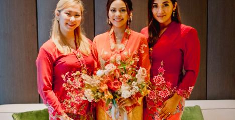 A bride and her bridesmaid wearing kebaya at a wedding. (c. 2020)