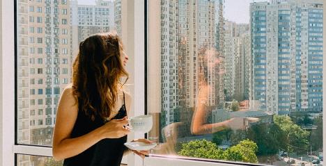 Women looking out of a high rise building in a Singapore property